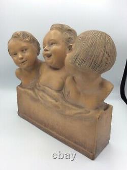 Sculpture bustes Trois enfants rieurs en terre cuite signé R. Pollin Art Déco