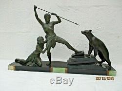 Sculpture couple chasseur ours blanc statue art deco Uriano Ugo Cipriani carving