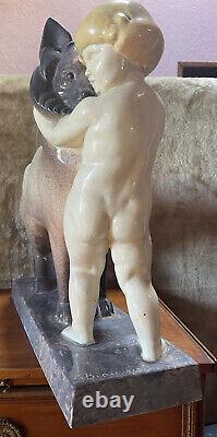Sculpture en céramique de G Beauvais Art Deco Signée le chien et l'enfant